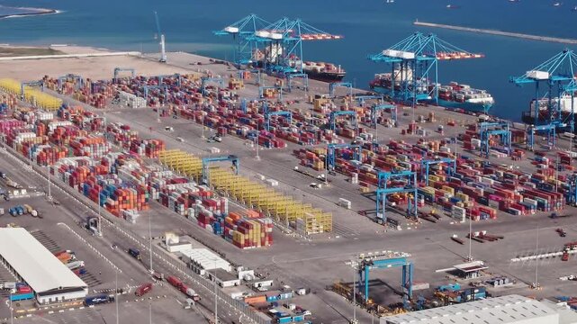 Large cargo port in Accra, Ghana with many shipping containers and cranes