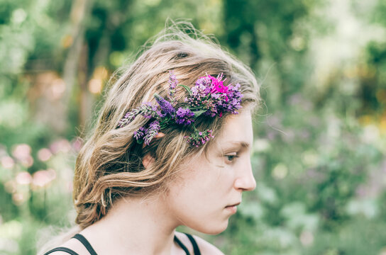 portrait of teenage girl with flowers in hair