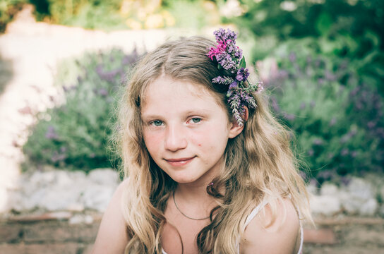 portrait of teenage girl with flowers in hair