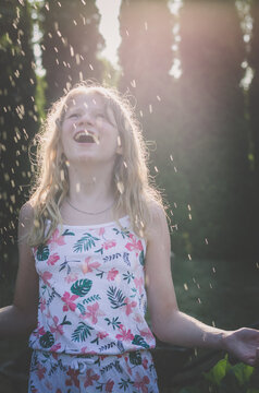 happy summer day with joy and fun, girl smiling and laughing in sunny day