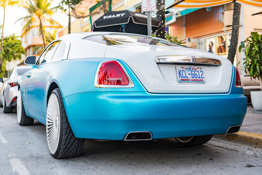 Miami, Florida, USA - April 08, 2025: Rolls Royce Wraith luxury grand tourer car. Grand tourer car Rolls Royce Wraith. Car Rolls Royce Wraith parked outdoor. White blue car, corner view