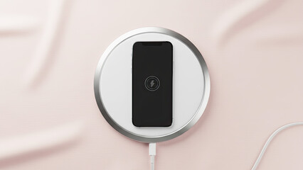 A flat lay view of a wireless charging pad for smartphones on a soft light pink background