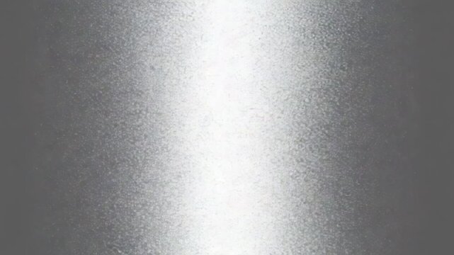 Close-up video of a textured metallic surface with a bright, reflective light streak moving across, creating a sleek and modern industrial background.
