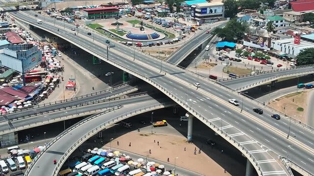 Accra city roads with busy traffic and shops in the daytime