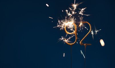 92 celebration festive background made with Bengal fires in the form of number Ninety two.