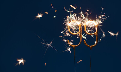 99 celebration festive background made with Bengal fires in the form of number Ninety nine.