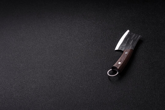 A kitchen cleaver or butcher's knife for cutting meat. A butcher's cleaver