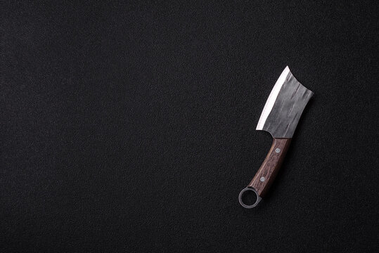 A kitchen cleaver or butcher's knife for cutting meat. A butcher's cleaver