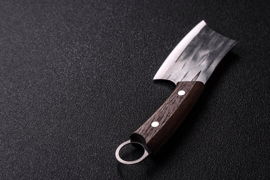 A kitchen cleaver or butcher's knife for cutting meat. A butcher's cleaver