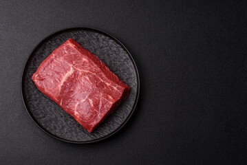 A piece of raw beef, a tenderloin for grilling or barbecue. Raw beef © chernikovatv
