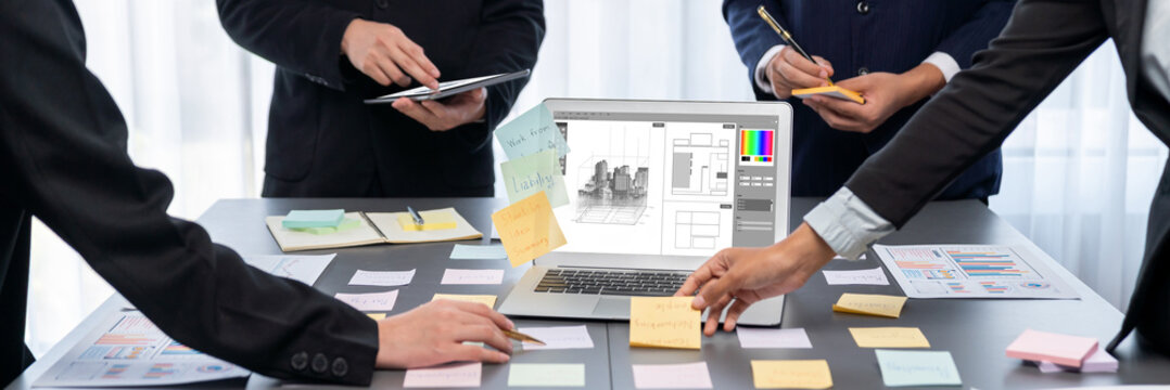 Analyst team use sticky note for creative and analytic brainstorm for business idea with BI data dashboard on laptop screen. Analysis financial data visualization tech for marketing strategy. Prodigy - Powered by Adobe