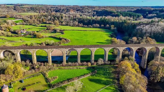 A rising aerial view flying above the cefn viaduct near Chirk, Wales