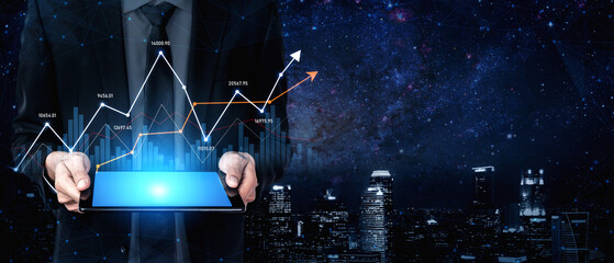 A professional business person holds a tablet displaying a financial growth chart, showcasing data analytics against a night city skyline and star-filled sky. Scalp