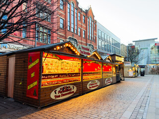 Fototapeta premium Manchester Christmas market stalls with personalized tree decorations and festive lights