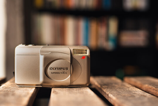 Barcelona, ​​Catalonia, Spain: January 15, 2026 The Olympus Superzoom 80 G is a compact 35mm film camera of the "point and shoot" style, popular in the 90s.