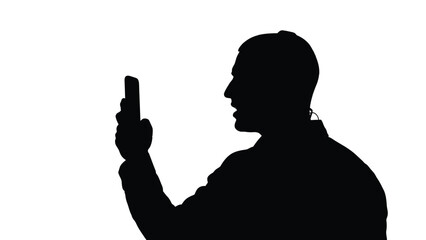 Silhouette of a man speaking into a smartphone while holding it vertically against a bright background
