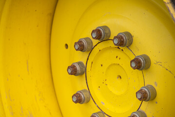 Close Up of Lug Nuts on a Heavy Vehicle Wheel The Concept of Industrial Texture