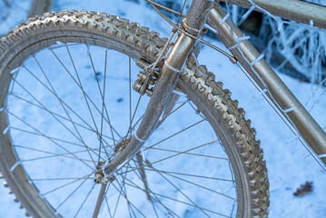 Golden Bicycle Wheels on Blue Snow The Concept of Festive Decoration