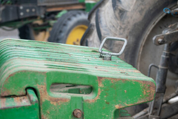 Close Up of a Green Tractor Front Counterweight The Concept of Agricultural Power