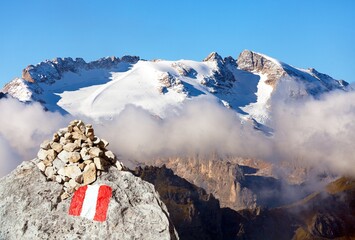 mount Marmolada peak with red and white tourist sign