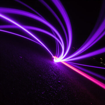 Vibrant neon purple speed rays on dark asphalt, motion blur effect with colorful light trails and stripes on a black background