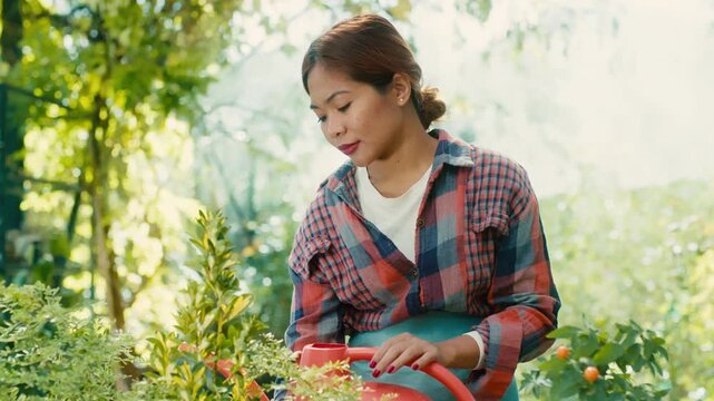 Woman in Greenhouse with Lush Plants