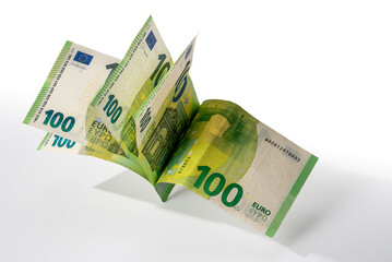 Hundred-euro banknotes scattered isolated on white with clipping path included