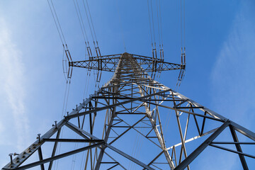 High-voltage pylon with cables for power supply.