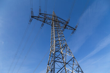 High-voltage pylon with cables for power supply.
