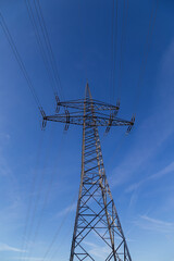 High-voltage pylon with cables for power supply.