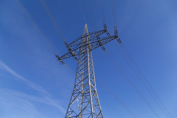 High-voltage pylon with cables for power supply.