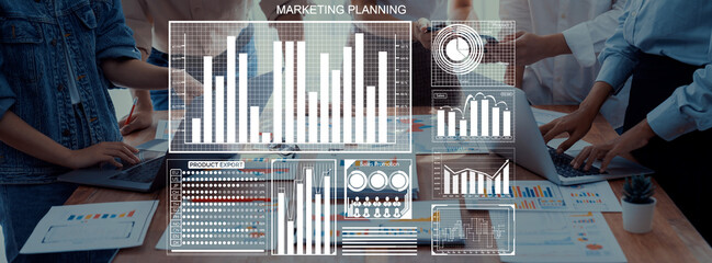 A dynamic team collaborates on marketing planning, using data visualization on charts and graphs to shape effective business strategies with innovative ideas. Axiom