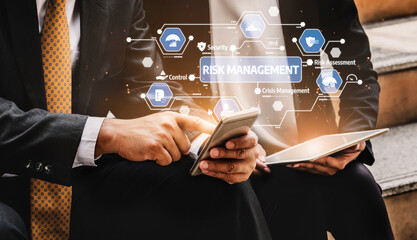 Two business professionals engage in a discussion about risk management while utilizing digital devices. Visual elements depict security and assessment concepts. Tessel