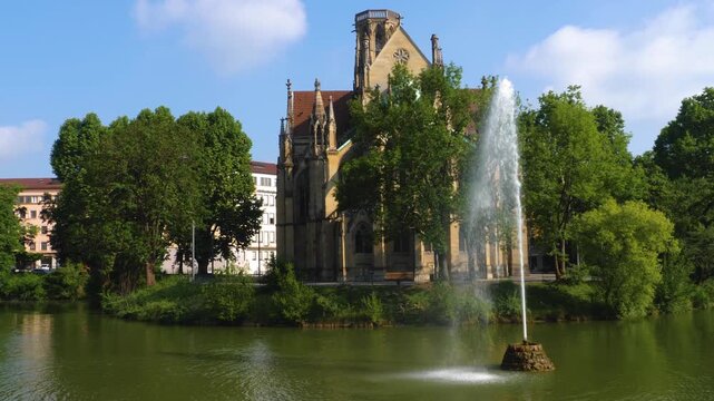 Street view of the Protestant Church of St John (German: Johanneskirche) in Stuttgart . On a sunny day in Spring
