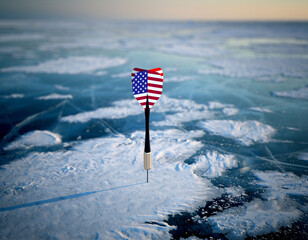 An arrow painted with the US flag stuck in ice, symbolizing Greenland and the perceived American threat, representing geopolitical tensions between the US and Denmark, which also affect the EU