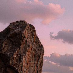 A captivating pink sky with fluffy clouds as the backdrop