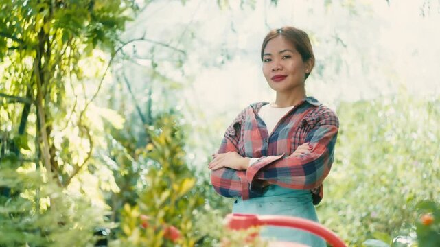 Woman in Greenhouse with Lush Plants