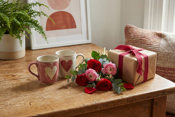 Valentines Day Gift with Roses and Heart Mugs on Wooden Table