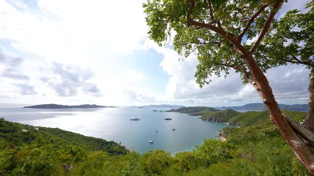 sailboats and yachts are anchored and moored in a beautiful cove and bay in the British Virgin Islands
