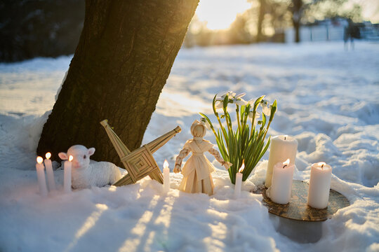 Imbolc altar celebrating brigid with lamb and snowdrops