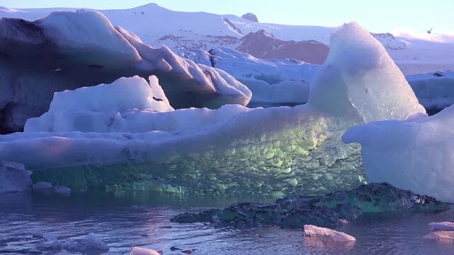 Ice floats in the frozen Arctic, Jokulsarlon, glacier lagoon in Iceland, suggesting global warming.