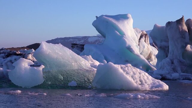 Ice floats in the frozen Arctic, Jokulsarlon, glacier lagoon in Iceland, suggesting global warming.