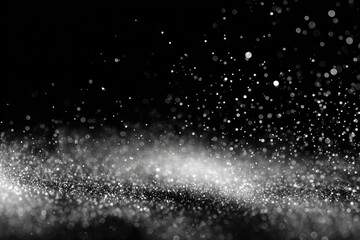 Obraz premium Black background with sparkling white particles scattered and blurred to create an abstract effect