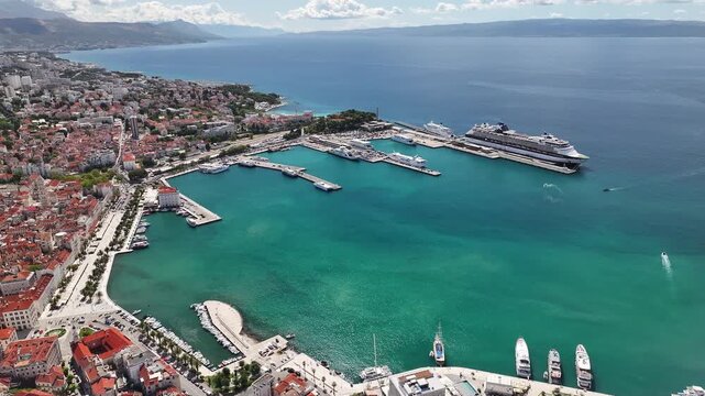Drone footage from Marjan Hill showing Split harbor, Riva promenade, and old town architecture under Mediterranean sunlight.