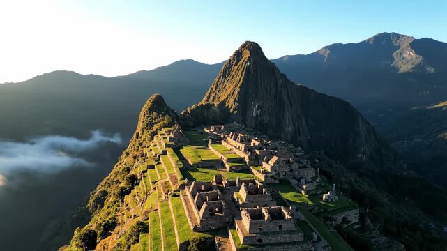 Aerial sunrise view of majestic ancient Inca citadel Machu Picchu ruins in the Andes Mountains Peru