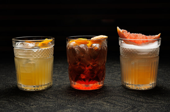 Refreshing cocktails served in glassware with citrus garnishes during an evening gathering