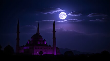 Majestic mosque illuminated under the full moon at night