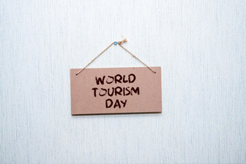White photo frame with text WORLD TOURISM DAY