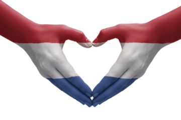 Expressing Dutch pride with hands forming a heart shape painted in the colors of the Netherlands flag for love and national unity