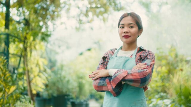 Woman in Greenhouse with Lush Plants